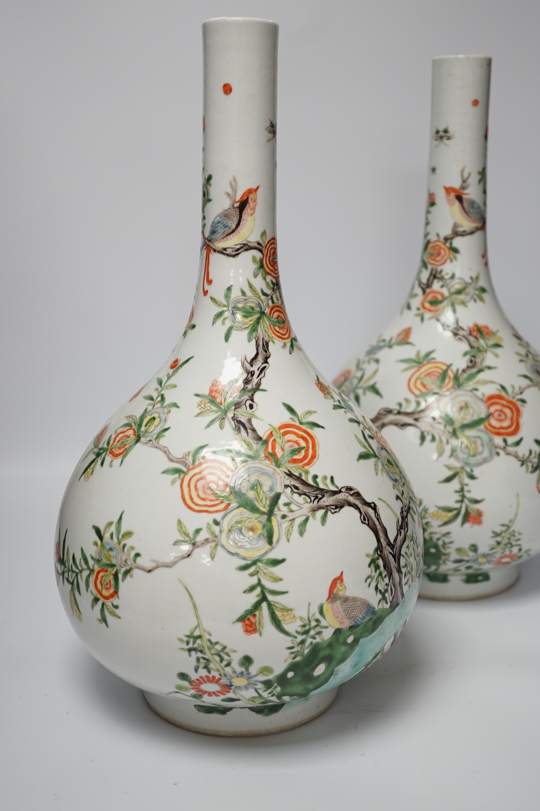 A pair of modern Chinese Kangxi style famille verte bottle vases, 40cm high